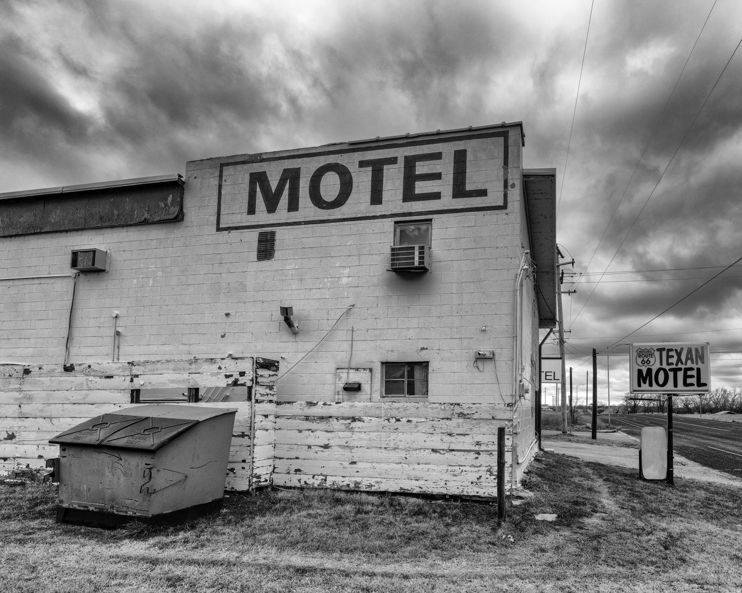 Motel - Black & White Photograph of Route 66 in Shamrock, Texas | Weathered Texan Motel on Photo Paper, Canvas, Acrylic, Metal